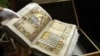 UKRAINE – Olha Stepchenko, a representative of the National Library of Ukraine, demonstrates the Peresopnytsia Gospel, written in 1556–1561. It is a landmark of the Old Ukrainian language. One of the symbols of the Ukrainian people. Kyiv, February 24, 201