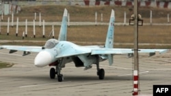 A Russian Su-27 SM fighter jet lands at Belbek military airport outside Sevastopol, Crimea, in November 2014.