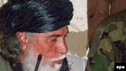 Muslim Khan talks with journalists in the Swat Valley on March 28.