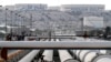 China Reassures Tehran On Honoring Nuclear Deal, Buying Iranian Oil