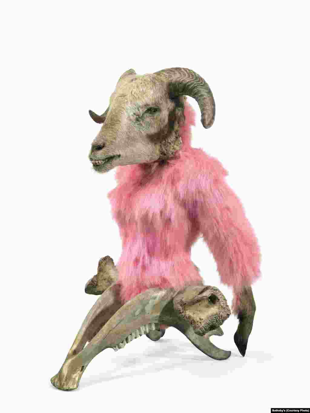 “Glamour Genetics,” a 2012 piece by Azerbaijani artist Mahmud Rustamov (b. 1967). The work incorporates a sheep’s head, goat feet, a cow’s lower jaw and thigh bone, and synthetic fur.