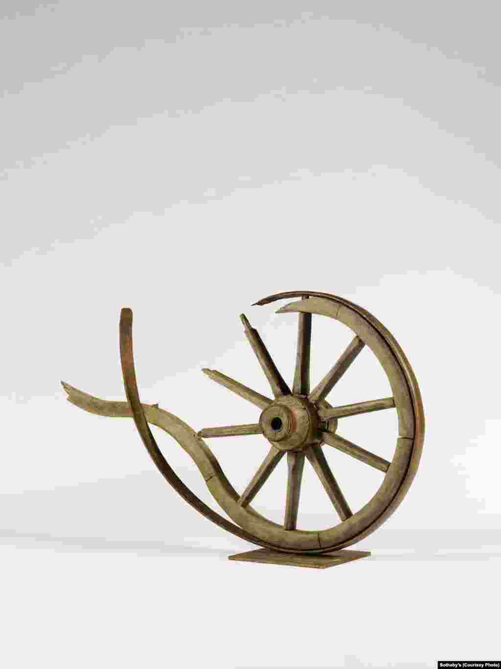 “Disintegration,” a 2012 wood and metal sculpture by Armenian artist Armen Gevorgyan (b. 1958). The broken wheel is symbolic of the Armenian people’s long history of resettlement.
